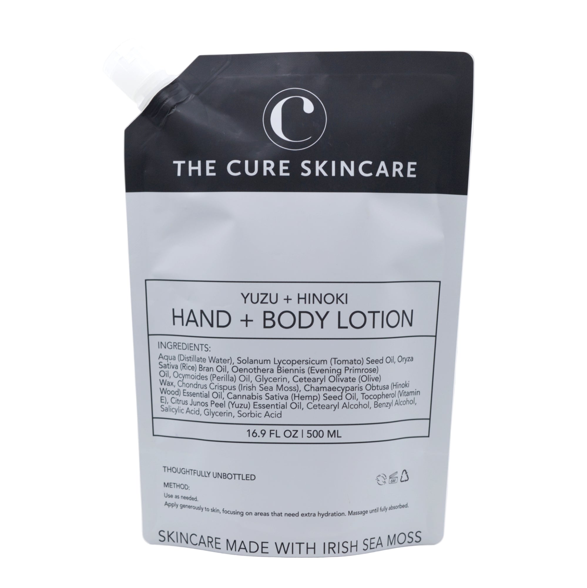 The Cure Skincare Yuzu + Hinoki Hand & Body Lotion packaging on a white background